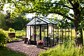 Greenhouse in summery garden
