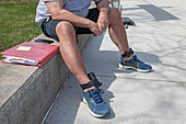 Man wearing electronic monitoring devices