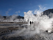 Steaming geysers and early morning light at El Tatio, Chile