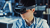 Electronics engineer wearing a virtual reality headset