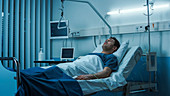 Ill patient lying on a bed in hospital