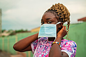 Young woman wearing face mask