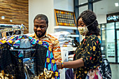 Man and woman in clothes shop