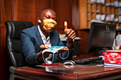 Businessman offering face mask