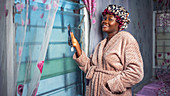 Woman in dressing gown and hair bonnet