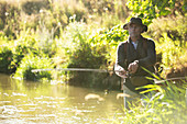 Man fly fishing at a river