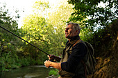 Man fly fishing at river