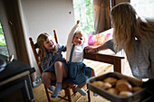 Mother and daughters in kitchen