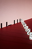 Line of dominoes, conceptual image