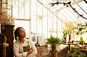 Female florist in greenhouse shop