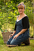 Happy woman gardening in backyard