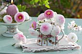 Mini-bouquet in a creamer made of Tausendschön rose Tasso 'Strawberry & Cream' and rockcress