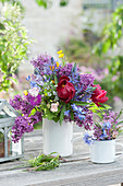 Early summer bouquet with lilacs, Peonies, camas, columbine, knapweed, speedwell, bluebells, buttercups, and lady's mantle leaves