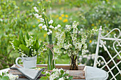 Romantic White blossoms of lilies of the valley, Spring Snowflake, and bird cherry