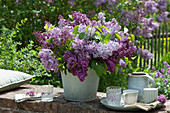 Lush bouquet of lilacs on the garden wall