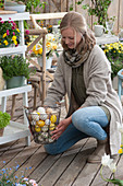 A woman holding a basket with Easter eggs