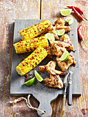 Chicken wings with grilled maize