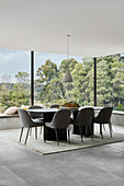 Elegant dining area with panoramic glass walls