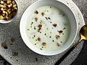 White asparagus soup from bowls with croutons