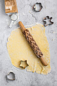 Biscuit dough with a rolling pin and biscuit cutters