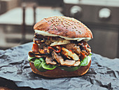 Halloumi, mushrooms, and spinach on a seeded burger bun