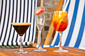 Espresso Martini coffee cocktail, Champagne cocktail with strawberry, Red and yellow Tequila Sunrise