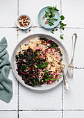 Steamed beetroot leaves with couscous