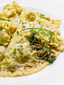 Pan-fried Maultaschen (stuffed pasta) with onions, ground sausage, and egg