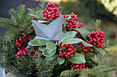 Galvanized poinsettia with sparkling berries and fir branches