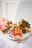 Spanish tapas baguettes with prawn, pepper sausage and mushrooms