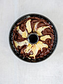 Fluffy marble cake - unbaked with raw cake batter in a baking pan
