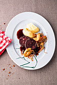 Black pudding with apples, shallots, and mashed potatoes