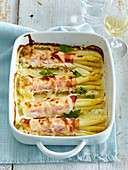 Gratinated asparagus with ham and goat cheese