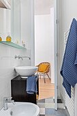 Small bathroom with sink and towel dryer