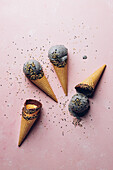 Black sesame ice cream with crunchy sesame seeds in chocolate wafers