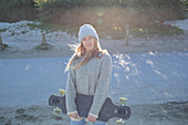 Young woman with skateboard