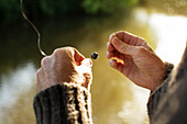 Man preparing weight on fly fishing line