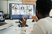 Businesswoman video conferencing at computer in office