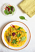 Saffron risotto with fontina, peas and herbs