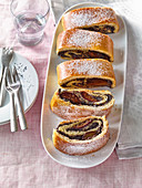 Poppy seed strudel with pickled plums