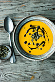 Vegan pumpkin and apple soup with coconut milk and ginger