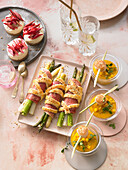 Baked asparagus parcels, mini cheesecakes, and mango-and-carrot soup