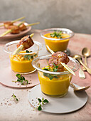 Mango-and-carrot soup with scallop skewers