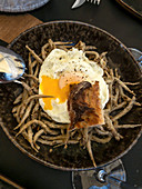 Fried small fish with egg
