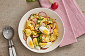 Potato and radish salad with boiled eggs