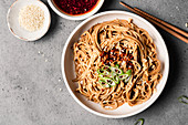 Spicy sesame noodles in a bowl