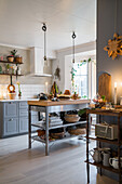 Candlelight in a Christmas decorated country kitchen in grey
