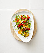 Hot marinated peppers with capers and rocket salad