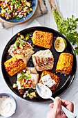 Cod with spicy salsa and corn
