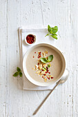 Cream of cauliflower soup with celery and almond puree
